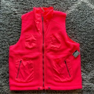 Free People Movement Hit the Hills neon coral reversible vest