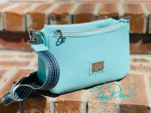 The Aries Crossbody Handbag in Baby Blue Marine Vinyl