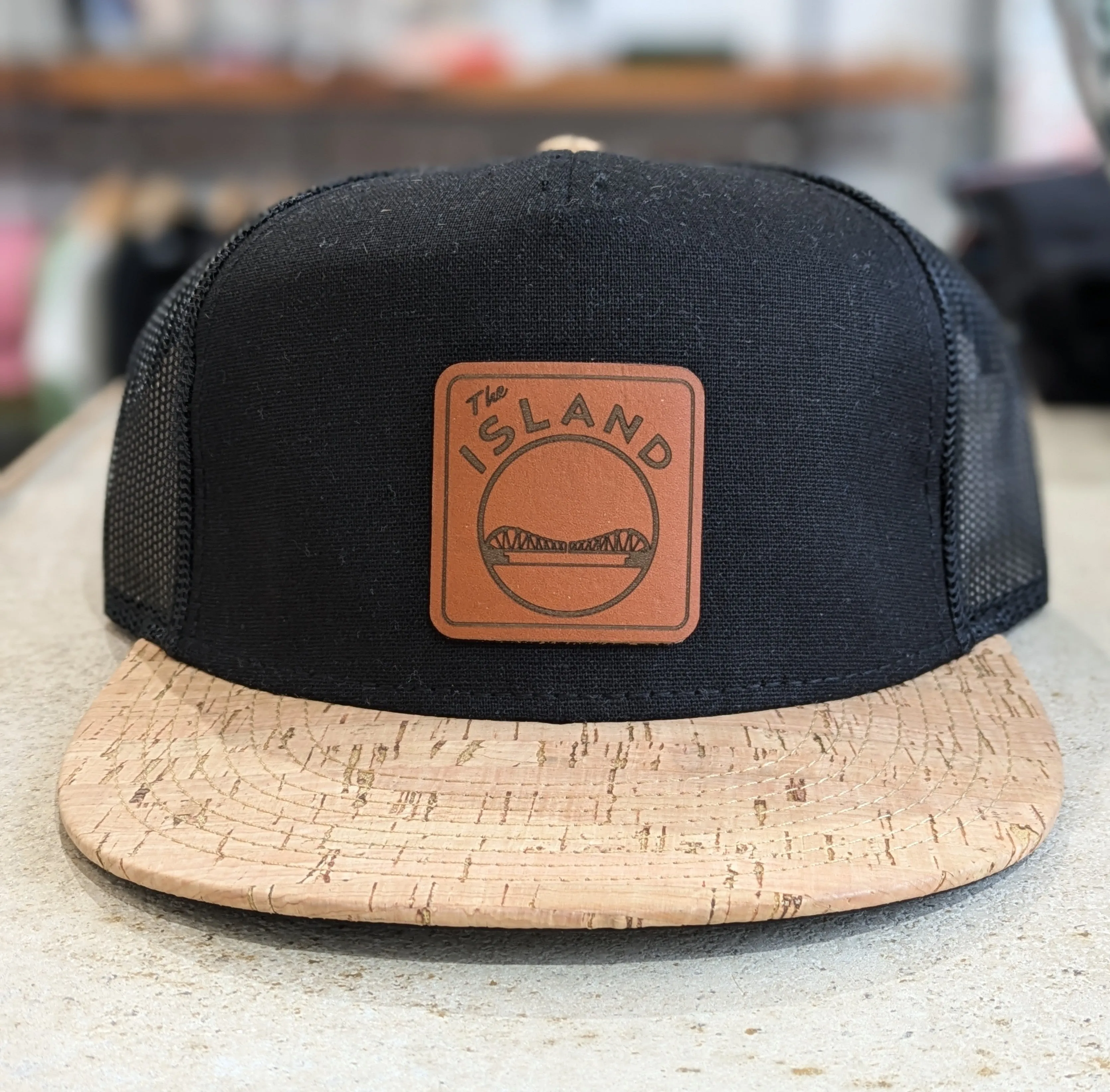 THE ISLAND LEATHER PATCH FLAT BILL HAT